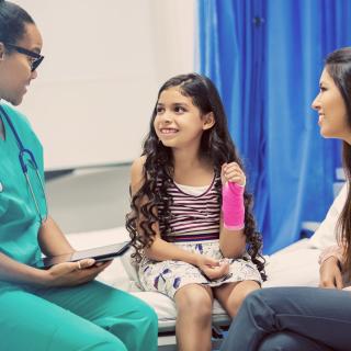 Girl with broken wrist being treated in the emergency room